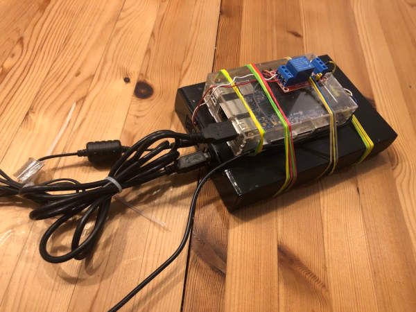 A small and slow single board computer, piggybacked and wired to a USB hard drive that is on life support